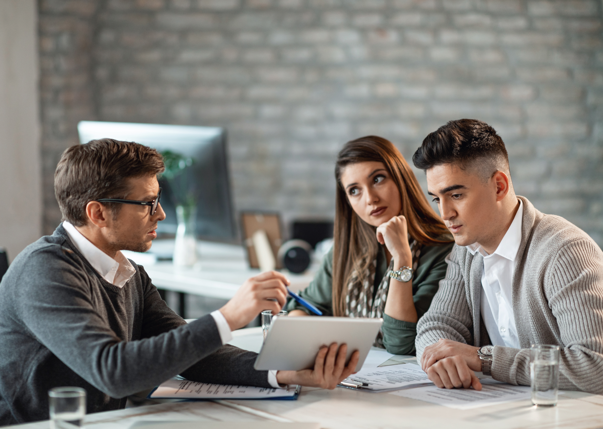 Insurance professionals reviewing information together during a client consultation
